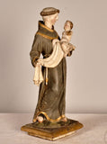 Antique carved and painted wood sculpture of Saint Anthony with child