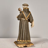 Antique carved and painted wood sculpture of Saint Anthony with child