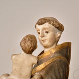 Antique carved and painted wood sculpture of Saint Anthony with child
