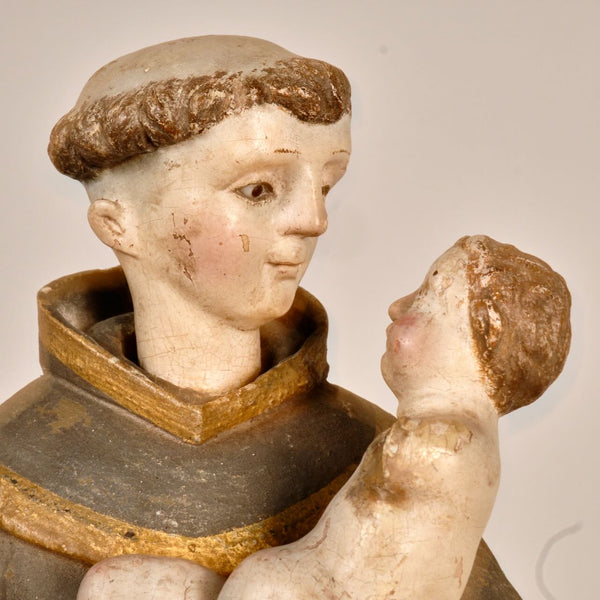 Antique carved and painted wood sculpture of Saint Anthony with child