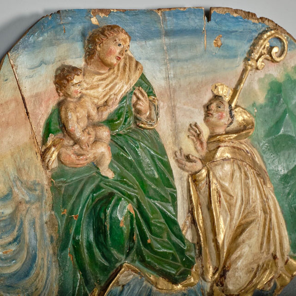 Pair of antique carved and polychromed bas relief panels, “The Visitation” and the “Stigmata of St. Francis”