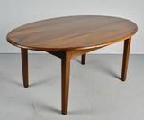 Antique tapered leg oval dining table, walnut