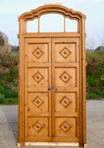Antique carved single-panel door with raised Mudejar overlay moldings, walnut