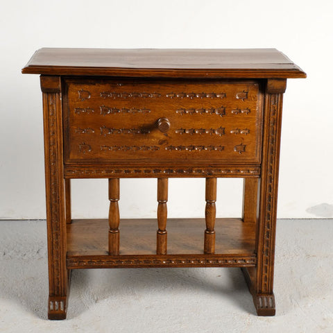 Pair of antique carved accent tables with drawer and stretcher shelf, oak and walnut