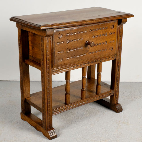 Pair of antique carved accent tables with drawer and stretcher shelf, oak and walnut