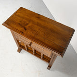 Pair of antique carved accent tables with drawer and stretcher shelf, oak and walnut