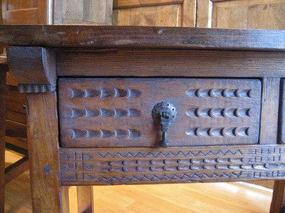 Carved two-drawer Renaissance-style table