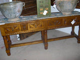 Carved four-drawer "Burgales" table