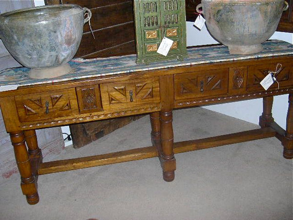 Carved four-drawer "Burgales" table