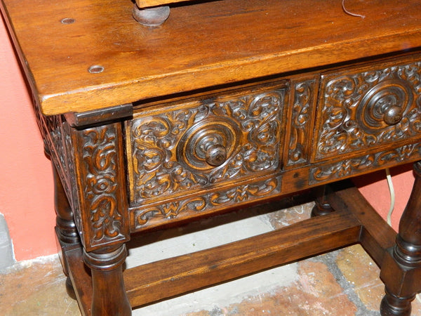 Carved two-drawer reproduction "Second Renaissance" table, cachimbo hardwood