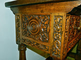 Carved two-drawer reproduction "Second Renaissance" table, cachimbo hardwood