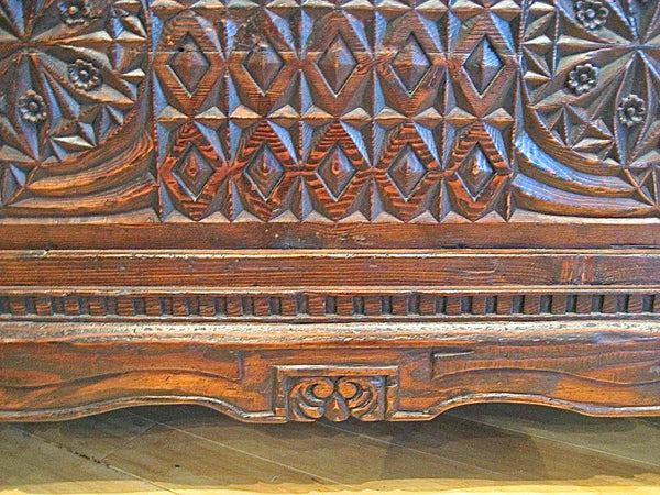 Heavily carved reproduction Basque arms chest, reclaimed pine