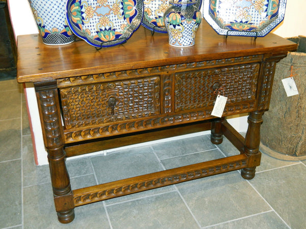 Carved two-drawer reproduction Spanish colonial library table