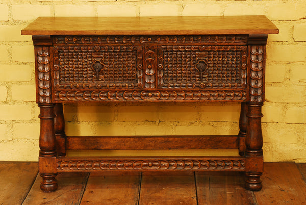 Carved two-drawer reproduction Spanish colonial library table