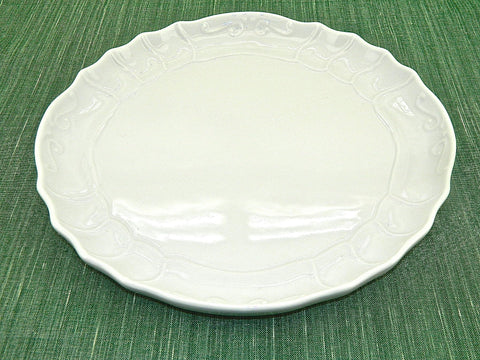 Large white refractory porcelain scalloped-edge serving platter