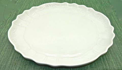 Small white refractory porcelain scalloped-edge serving platter