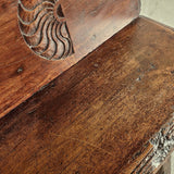 Antique trestle leg walnut bench with carved sun symbols